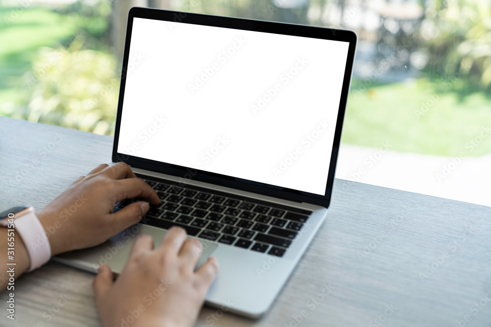 Mockup of a businessman using laptop computer white screen mockup template with clipping path. Mockup of a businessman using laptop computer white screen mockup template with clipping path.