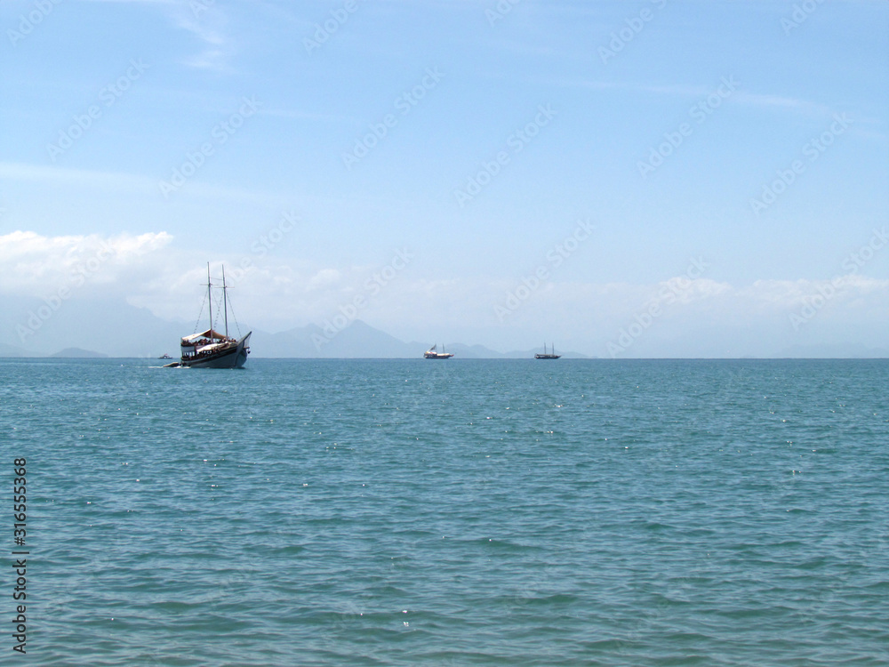 Tour boats on a calm sea