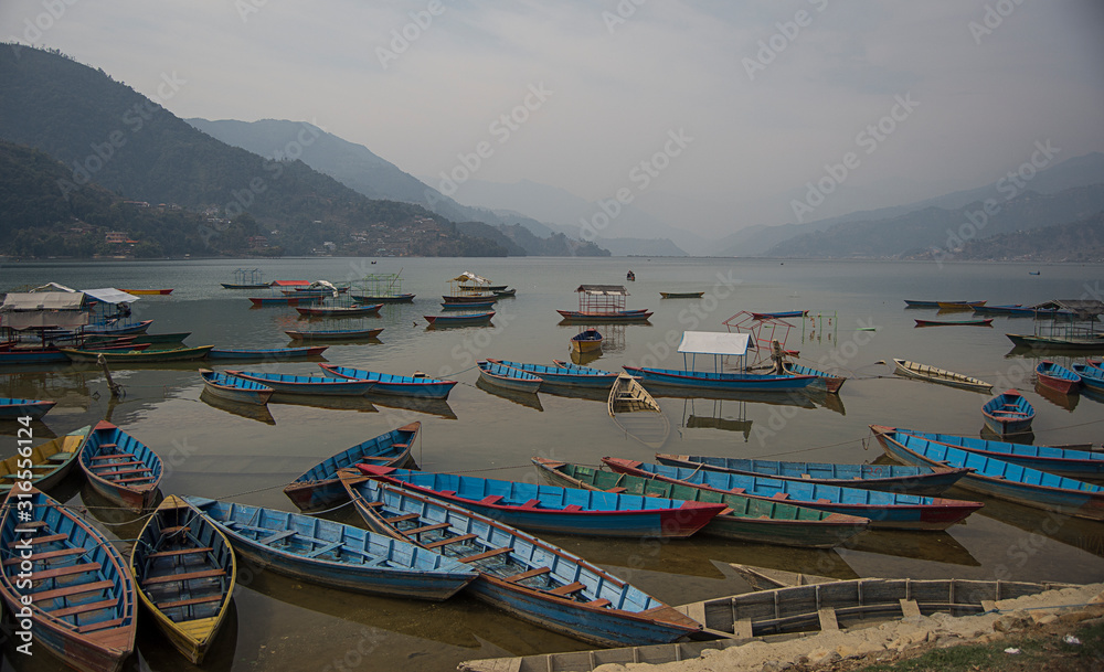 boats in phewa tal lake, pokhara, nepal