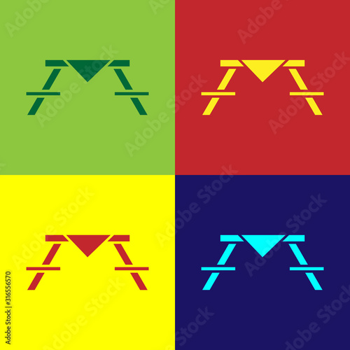 Color Picnic table with benches on either side of the table icon isolated on color background. Vector Illustration