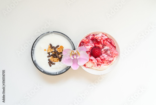 Greek yogurt in bowl with spoons,Healthy breakfast with Fresh greek yogurt, muesli and berries on background