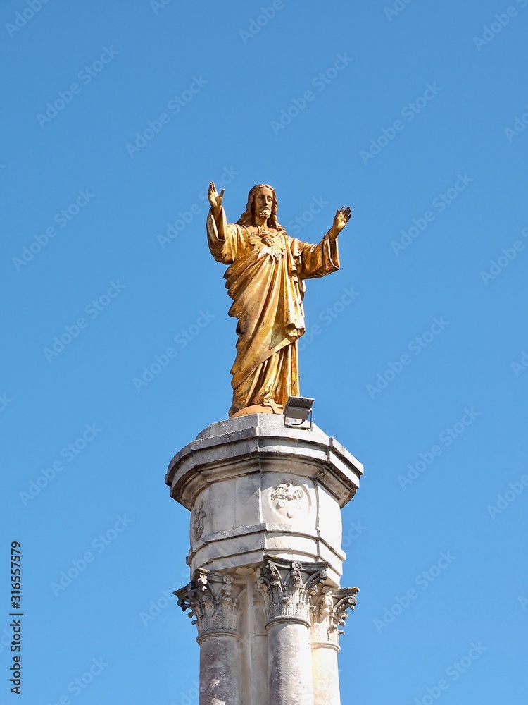 Sculpture of Jesus Christ in Fatima in Portugal near Lisboa with blue sky