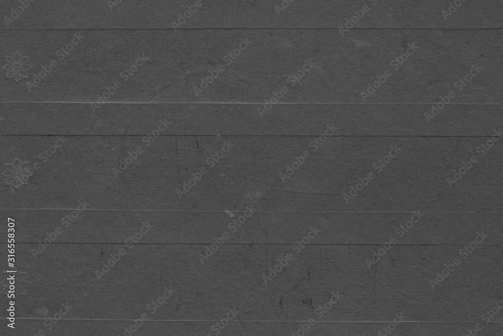 Fototapeta premium Cardboard black abstract texture close-up. Dark old paper background. Grunge concrete wall. Vintage blank wallpaper.