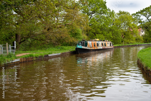 Scenic canal view with mooring narrowboats on the Llangollen Canal near Whitchurch, Shropshire, UK photo