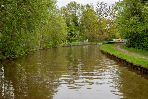Scenic canal view with mooring narrowboats on the Llangollen Canal near Whitchurch  Shropshire  UK