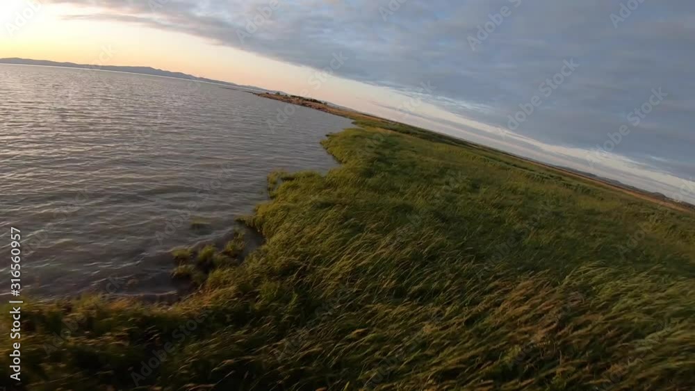 Aerial view drom a drone off a sunset next to St-Lawrence river in Quebec Canada Aerial view drom a drone off a sunset next to St-Lawrence river in Quebec Canada