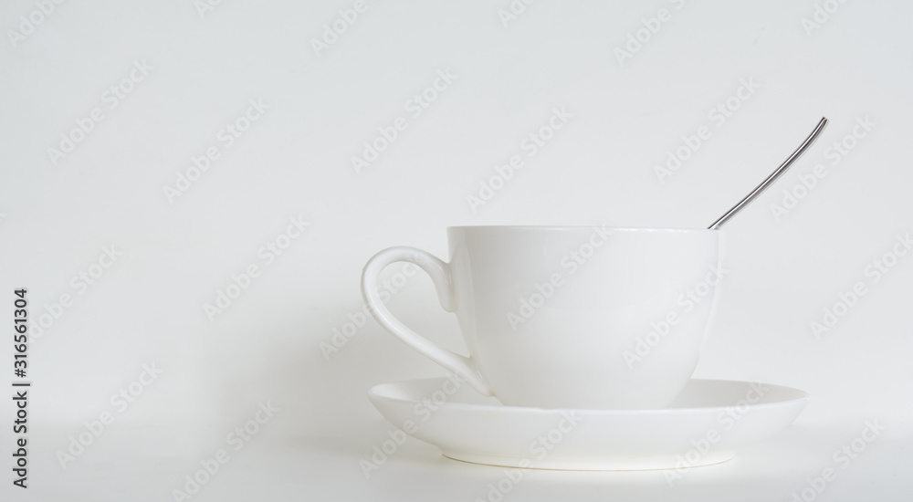 coffee cup with saucer and a teaspoon on a white background. Concept - cafe, restaurant. Copy space coffee cup with saucer and a teaspoon on a white background. Concept - cafe, restaurant. Copy space