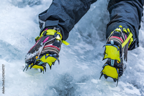 Closeup of Hiking Boots with Mounted Crampons used for Ice Climbing