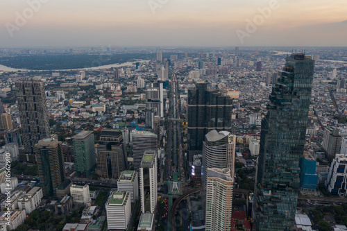 beautiful city view at twilight scene City scape of MahaNakhon building, skyscraper in the Silom/Sathon central business district of Bangkok as the tallest building in Thailand photo