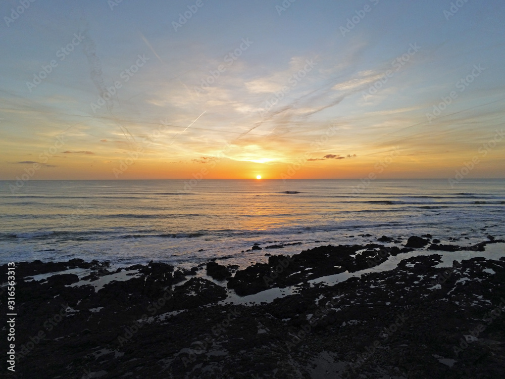 Obraz premium Coucher de soleil sur l'Anse aux moines