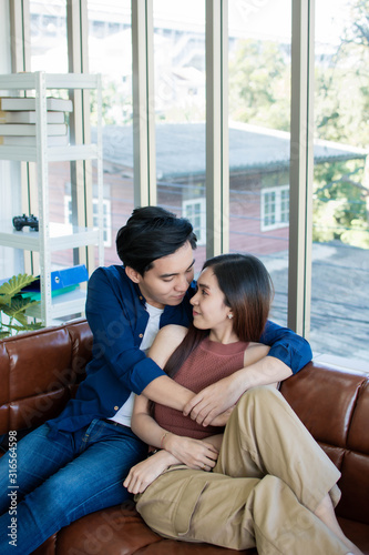 A couple is sitting in living room