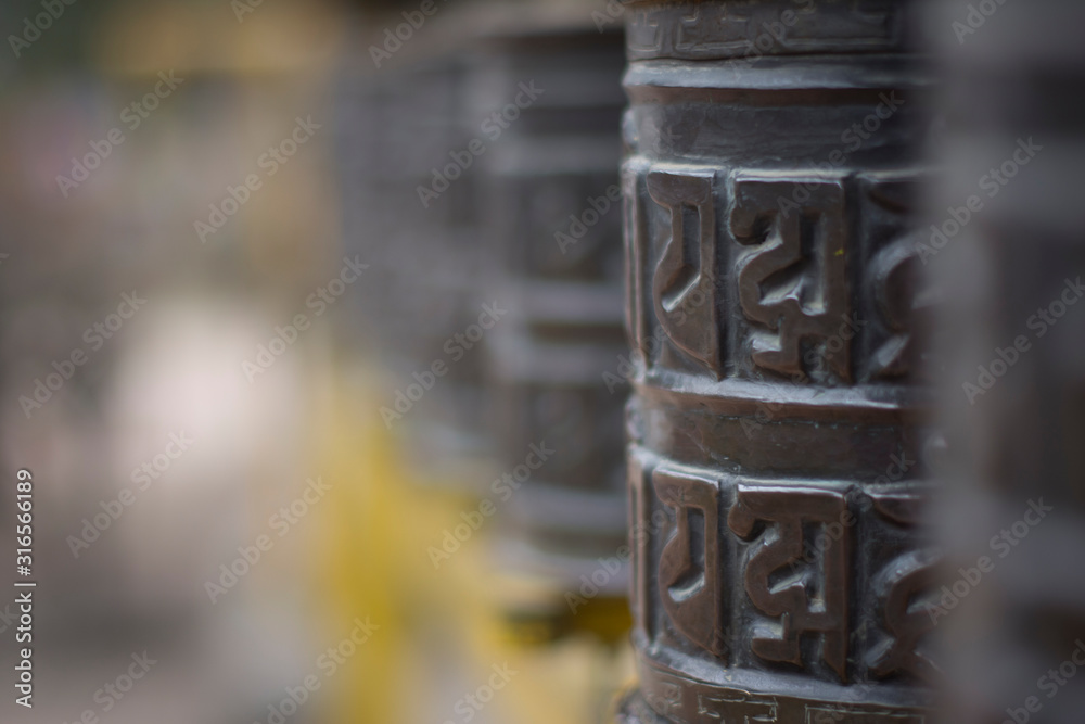 Buddhist prayer wheels in Kathmandu, Nepal Buddhist prayer wheels in Kathmandu, Nepal