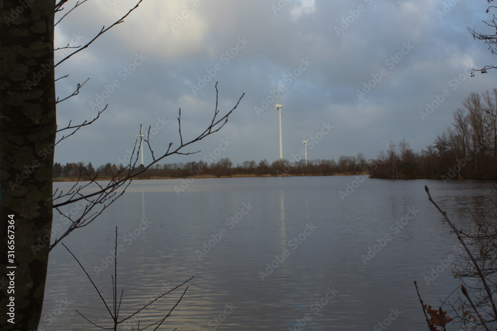 Windmills on a winter day shape the landscape in East Frisia
