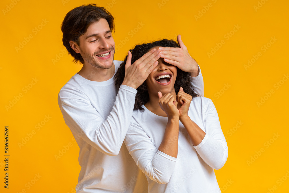 Loving Guy Covering Eyes Of His Afro Girlfriend, Surprising Her Loving Guy Covering Eyes Of His Afro Girlfriend, Surprising Her