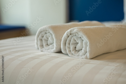 Bath towel on the bed in the hotel