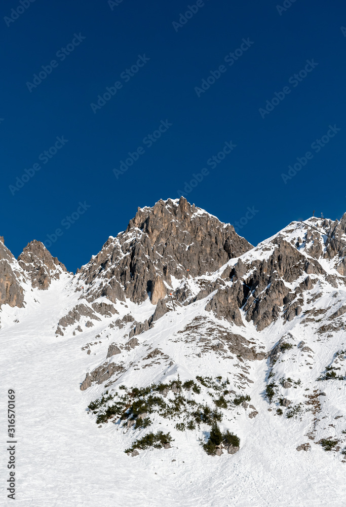 Snowy mountain peaks on a clear day on the Alps