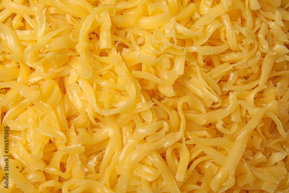 Delicious grated cheese as background, top view Delicious grated cheese as background, top view