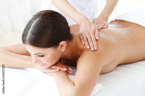 Woman at massage in a spa center