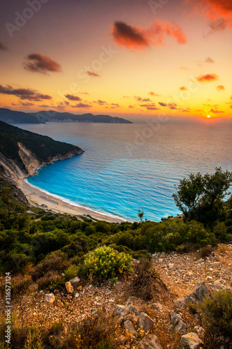 Fototapeta Naklejka Na Ścianę i Meble -  Beautiful summer sunset on Mirtos beach in Greece