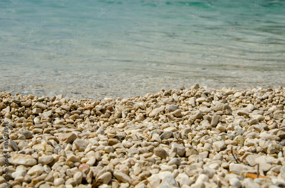 Stony beach - Stone and water in macro photo Stony beach - Stone and water in macro photo