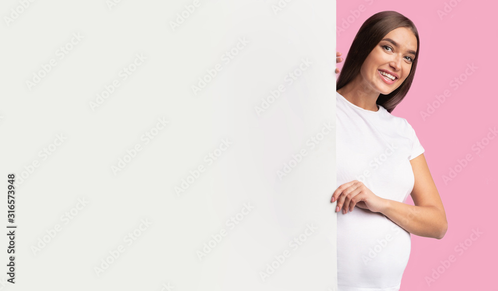 Pregnant Woman Peeking Out Of White Board, Pink Background, Mockup Pregnant Woman Peeking Out Of White Board, Pink Background, Mockup