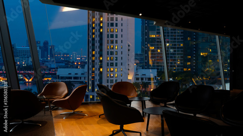 Bangkok city view point from Lounge interior. overlooking a magnificent cityscape blue sky and city in Thailand. photo
