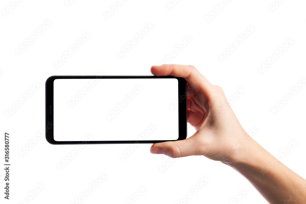 Woman holding smartphone with empty screen isolated on white background. Female hand with phone, space for text - obrazy, fototapety, plakaty 