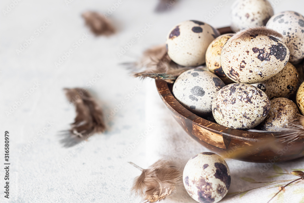 Spring Easter holiday. Zero waste Easter concept with traditional Easter decoration – quail eggs in a coconut bowl. Eco friendly lifestyle, copy space. Spring Easter holiday. Zero waste Easter concept with traditional Easter decoration – quail eggs in a coconut bowl. Eco friendly lifestyle, copy space.