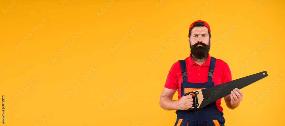 brutal male worker with saw. man builder yellow background. professional repairman in uniform. build and construction. Skilled architect repair and fix. engineer worker career. professional skills brutal male worker with saw. man builder yellow background. professional repairman in uniform. build and construction. Skilled architect repair and fix. engineer worker career. professional skills