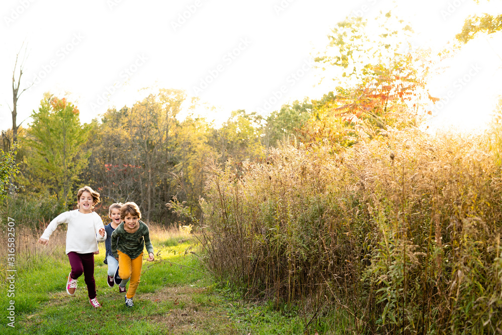 Young girls racing each other outdoors in a park