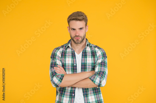 Wallpaper Mural Male beauty standards. Masculine Outfits And Look. stylish male in fashionable clothing. handsome man in checkered shirt and jeans. confident student yellow background. casual fashion for men Torontodigital.ca