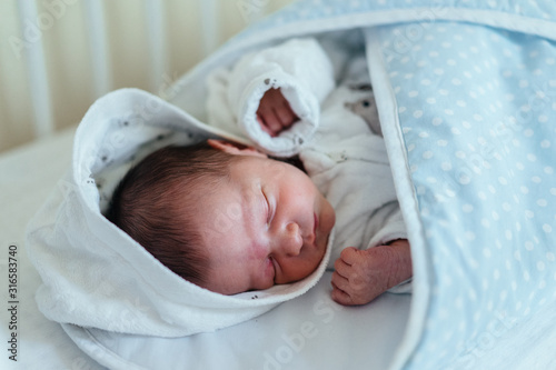 Authentic photography of a newborn with slightly lower birth weight.  photo