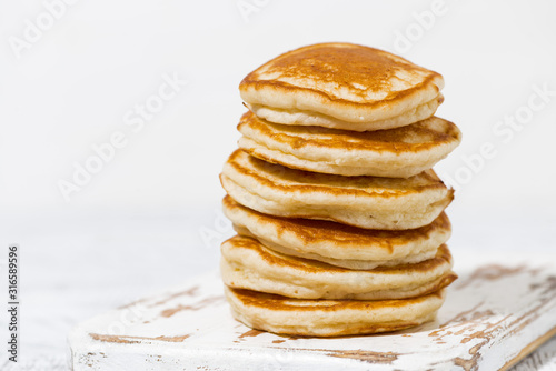 stack of delicious pancakes on a white background, closeup