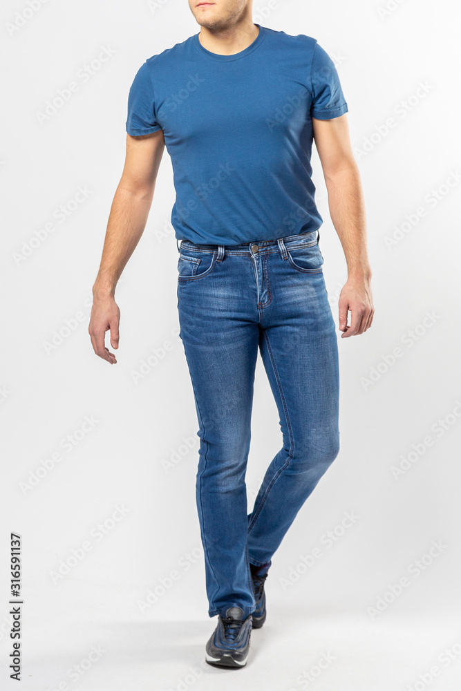 man in jeans, denim pants closeup on white background, blue jeans man in jeans, denim pants closeup on white background, blue jeans