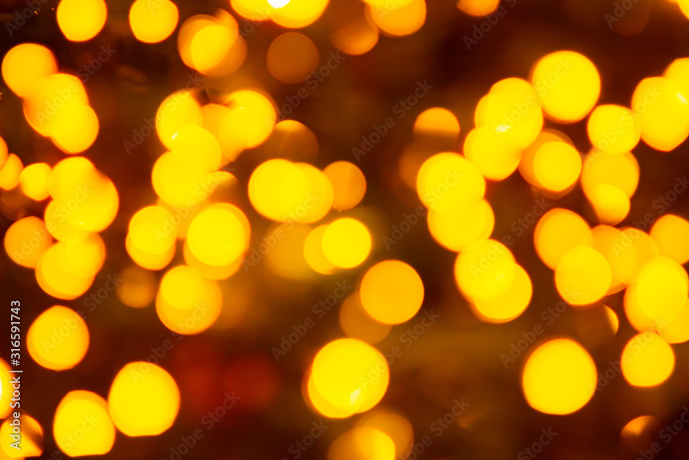Gold yellow abstract background with bokeh defocused blurred lights