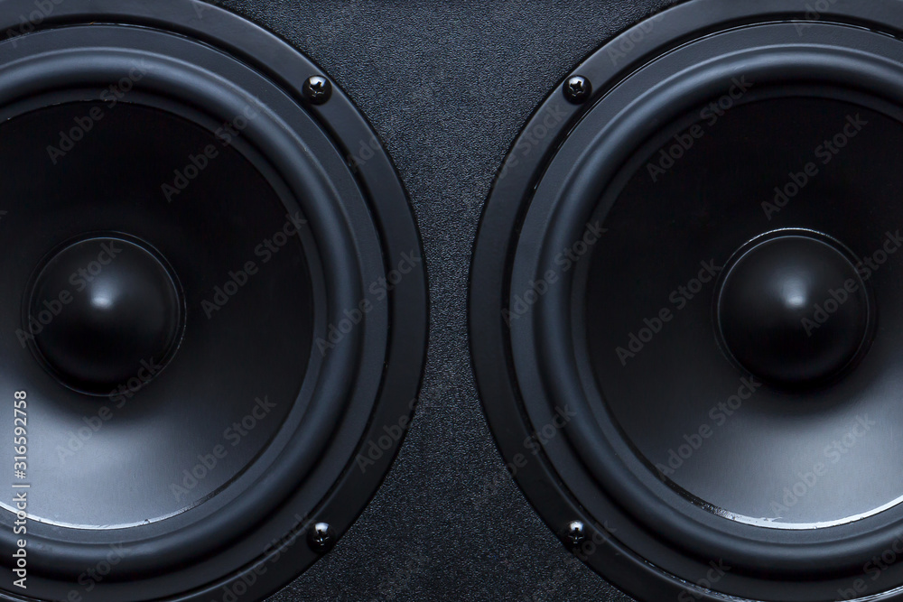 Two black speakers close-up as a background. - obrazy, fototapety, plakaty 