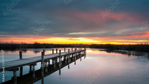 Jetty on lake neusiedlersee in Burgenland at sunrise
