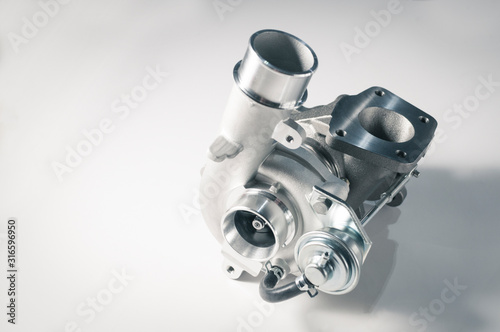 Fotografi new turbocharger of car on white background.