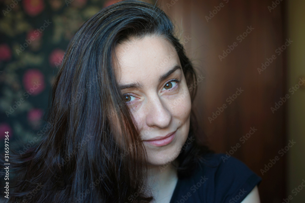 Portrait of a woman without makeup with a little gray hair Portrait of a woman without makeup with a little gray hair