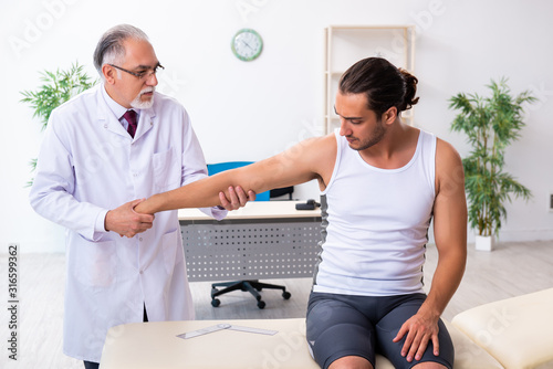 Young male patient visiting experienced doctor