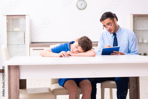 Busy father helping his son to prepare for exam