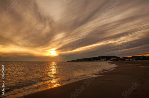 Empty sand beach by the sea at sunset  Montenegro  Ulcinj .Long beach