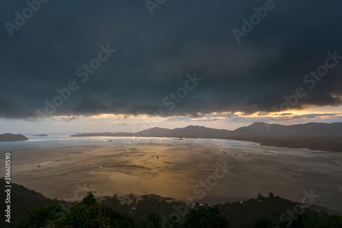 Fototapeta Naklejka Na Ścianę i Meble -  Kao Khad Viewpoint of Phuket city at sunset time with raincloud, Phuket, Thailand