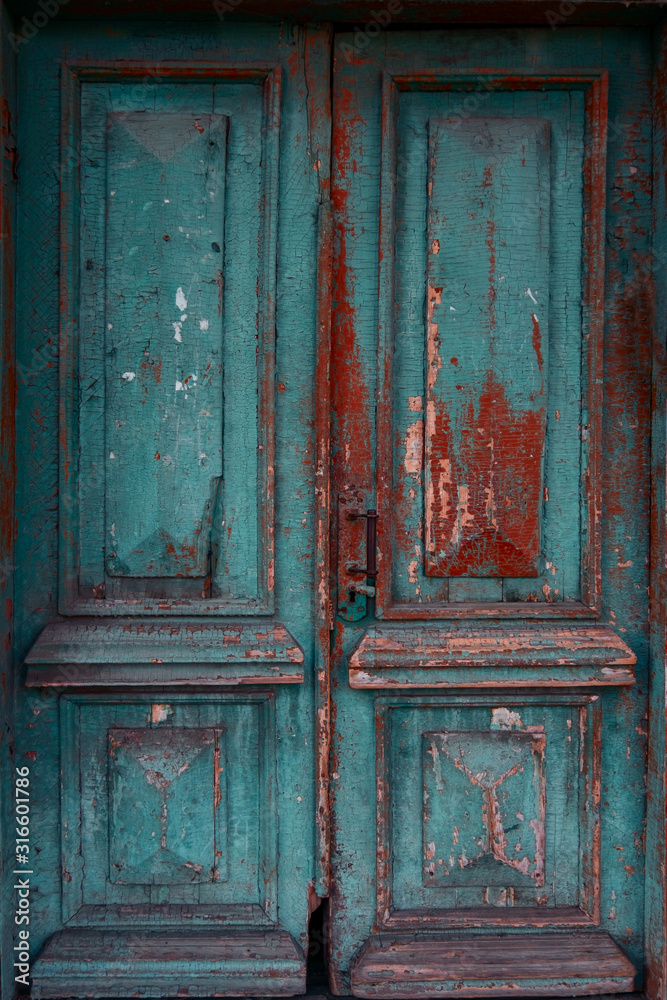 close up ancient blue and brown shabby  door