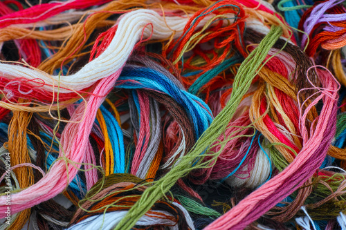 Colored embroidery threads. Full frame.
