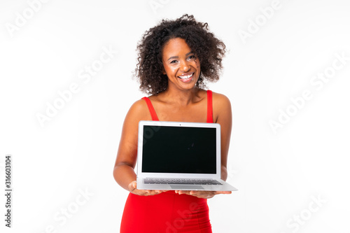 african girl shows a laptop display with a mockup on a white background