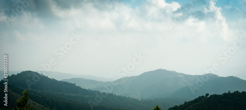 Cyprus mountain landscape panorama, aerial view in fog, mist or low lying clouds in sunlight. Beautiful mediterranean nature. photo