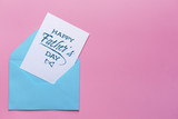 Envelope and greeting card for Father's Day on color background
