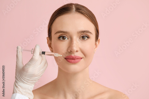 Young woman receiving fille...