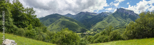 Green mountains and cloudy sky
